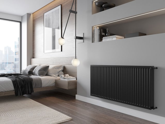 Melnais radiators istabā