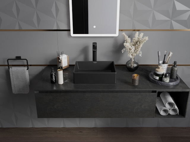 Stilīgs melns izlietnes skapītis vannas istabas dizainā